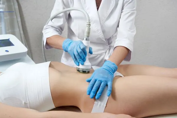 Lost the Weight but Not the Loose Skin? 2 woman having HIFU treatment on her stomach to combat loose skin Horsham following weight loss